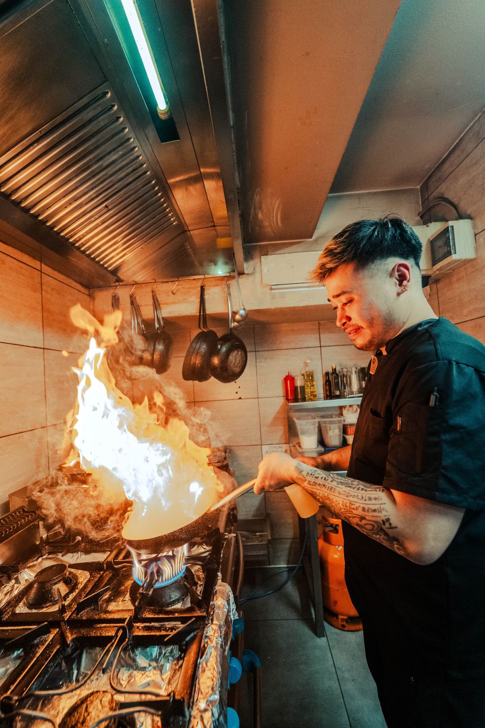 Chef flambéing in the Corso kitchen